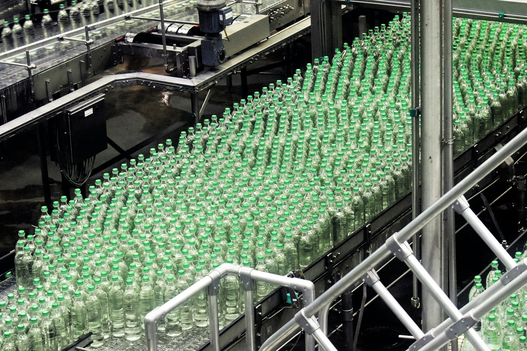 Glass bottles moving along an industrial bottling line